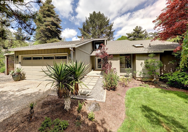 12420 Orchard Hill Rd, Lake Oswego, OR 97035 - single story home with a garage, a front lawn, a shingled roof, board and batten siding, and driveway