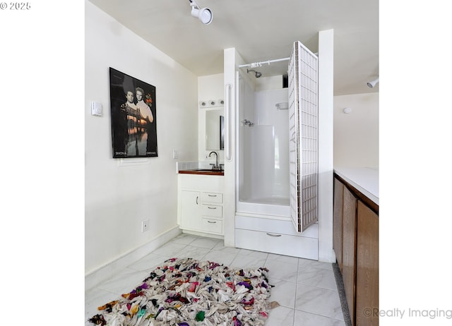 12420 Orchard Hill Rd, Lake Oswego, OR 97035 - full bathroom featuring vanity, marble finish floor, shower / tub combination, and baseboards