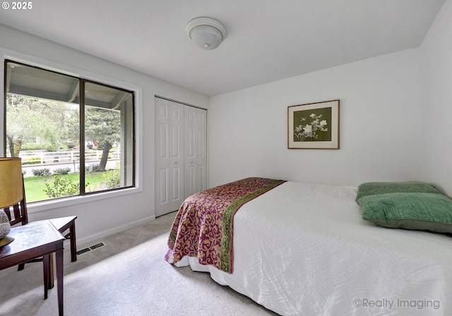12420 Orchard Hill Rd, Lake Oswego, OR 97035 - bedroom with visible vents, baseboards, a closet, and light colored carpet