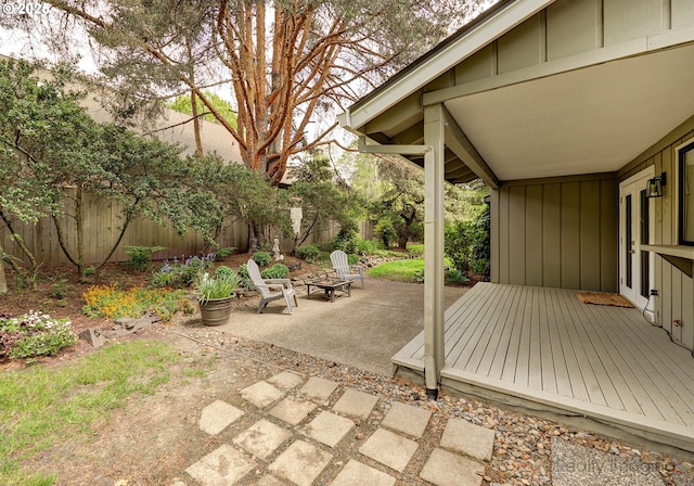 12420 Orchard Hill Rd, Lake Oswego, OR 97035 - view of patio / terrace featuring a wooden deck, a fenced backyard, and an outdoor fire pit