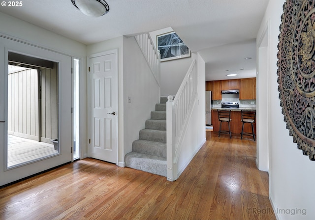 12420 Orchard Hill Rd, Lake Oswego, OR 97035 - foyer entrance with recessed lighting, stairway, baseboards, and light wood finished floors