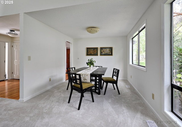 12420 Orchard Hill Rd, Lake Oswego, OR 97035 - dining area featuring baseboards, visible vents, and light carpet