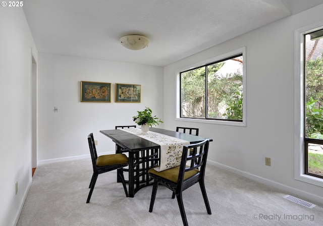 12420 Orchard Hill Rd, Lake Oswego, OR 97035 - dining room featuring visible vents, baseboards, a wealth of natural light, and light colored carpet
