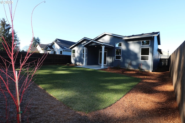 view of front of house featuring a patio area and a front lawn