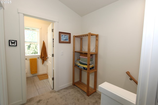 611 SE 142nd Ave Unit B, Portland, OR 97233 - hallway featuring an upstairs landing, light colored carpet, baseboards, and lofted ceiling