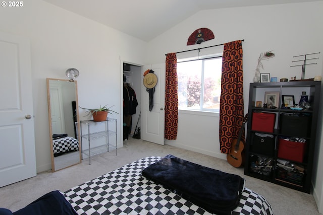 611 SE 142nd Ave Unit B, Portland, OR 97233 - bedroom featuring lofted ceiling, carpet floors, a closet, and baseboards