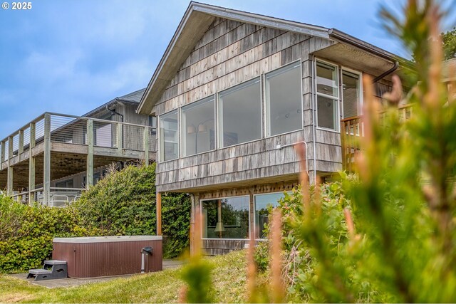 back of property featuring a sunroom
