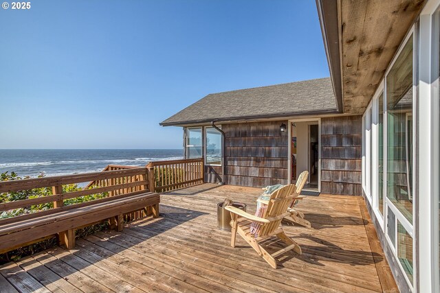 deck featuring a water view