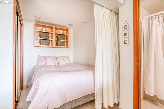 bedroom featuring light tile patterned floors
