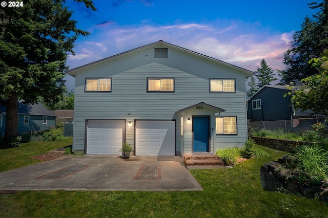 108 SE 133rd Ave, Portland, OR 97233 - traditional-style home with an attached garage, fence, driveway, and a front lawn