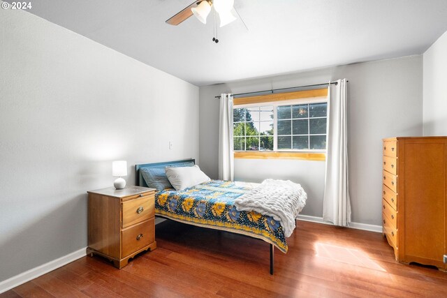 108 SE 133rd Ave, Portland, OR 97233 - bedroom featuring baseboards, ceiling fan, and wood finished floors