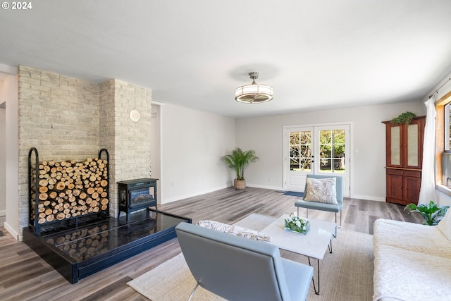 108 SE 133rd Ave, Portland, OR 97233 - living room with baseboards, a wood stove, and wood finished floors