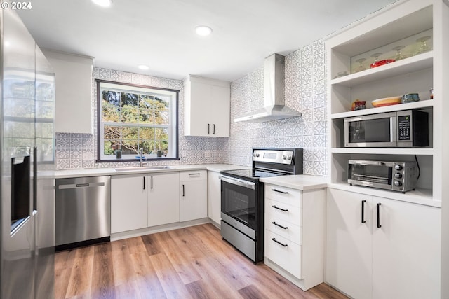 108 SE 133rd Ave, Portland, OR 97233 - kitchen with wall chimney range hood, appliances with stainless steel finishes, a sink, light countertops, and backsplash
