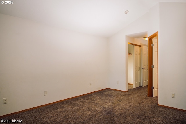 7942 N Hurst Ave, Portland, OR 97203 - unfurnished room featuring carpet flooring, lofted ceiling, and baseboards
