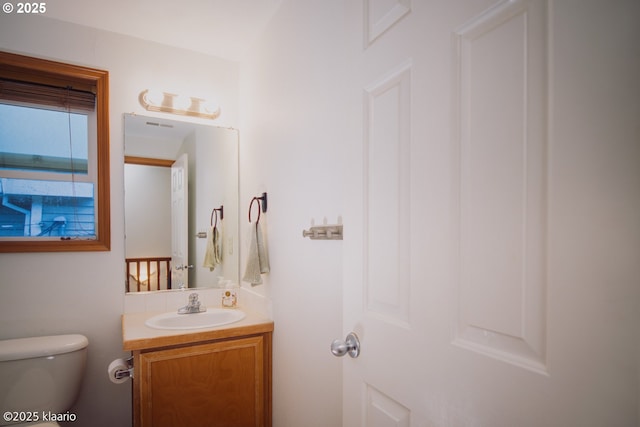 7942 N Hurst Ave, Portland, OR 97203 - half bath featuring vanity and toilet