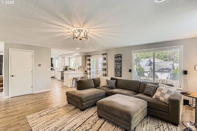 1736 Regency St, West Linn, OR 97068 - living room with light wood finished floors, a textured ceiling, and recessed lighting