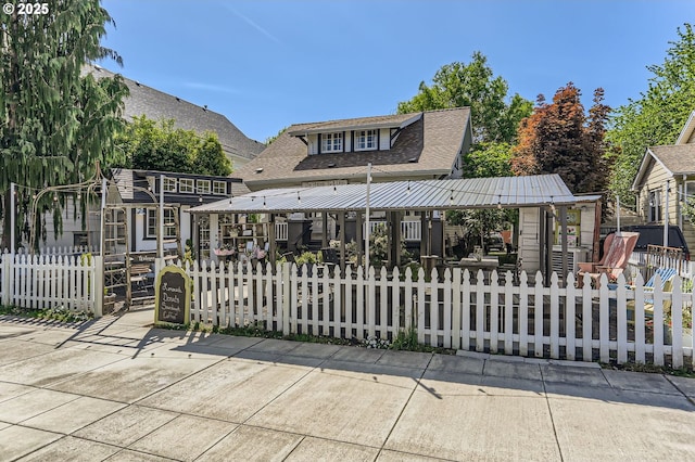 1736 Regency St, West Linn, OR 97068 - rear view of property featuring a fenced front yard and a shingled roof