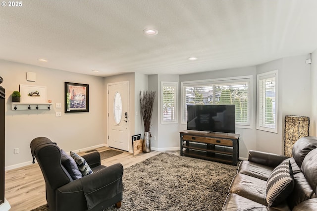 1736 Regency St, West Linn, OR 97068 - living room featuring light wood finished floors, recessed lighting, and a textured ceiling