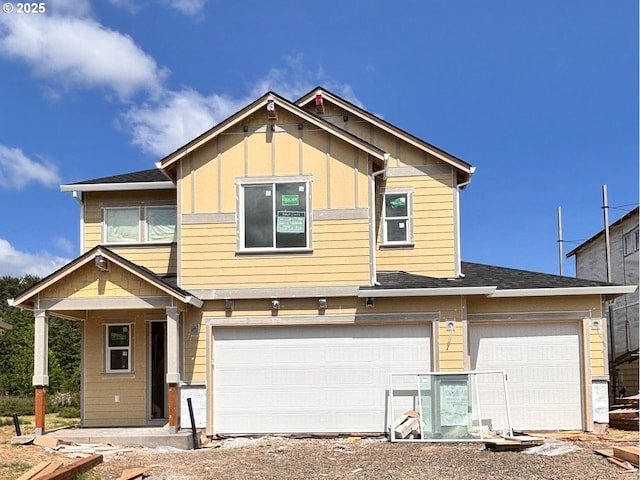 17393 SW Atfalati Ln Unit 44, Sherwood, OR 97140 - view of front of property with an attached garage, board and batten siding, and driveway