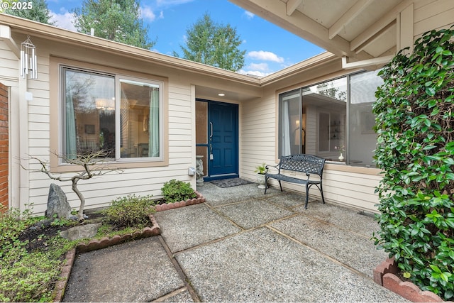 doorway to property with a patio area