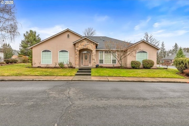 ranch-style home with a front lawn