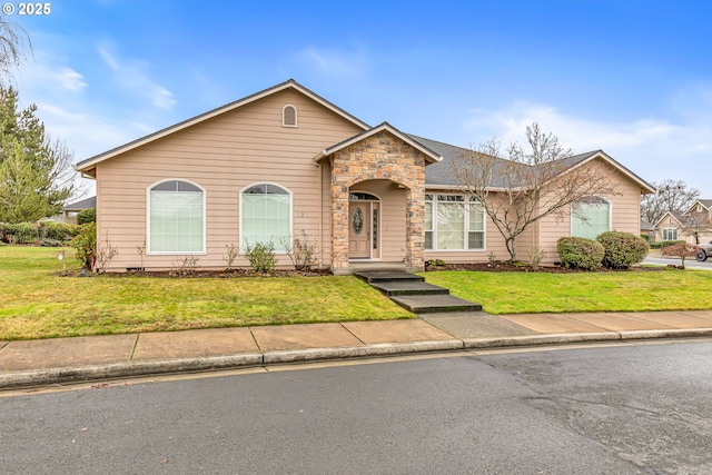 ranch-style home featuring a front lawn