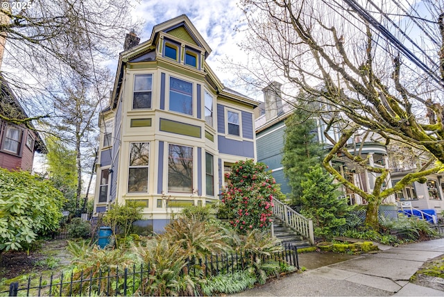 2122 NW Everett St, Portland, OR 97210 - victorian home with a chimney and stairway