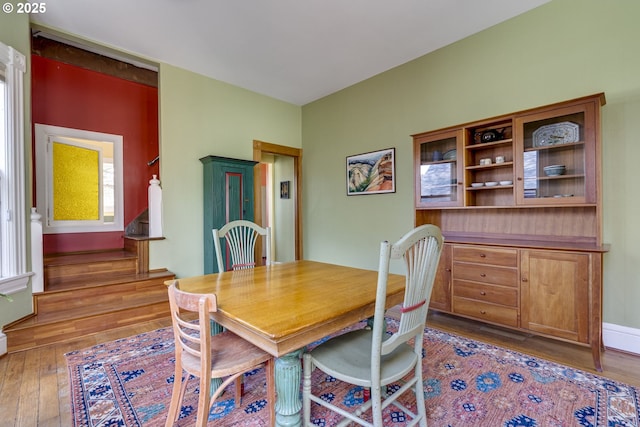 2122 NW Everett St, Portland, OR 97210 - dining area featuring wood-type flooring and stairs