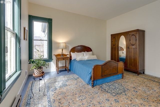 2122 NW Everett St, Portland, OR 97210 - bedroom featuring a baseboard radiator and baseboards