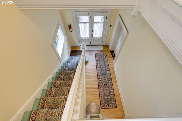 2122 NW Everett St, Portland, OR 97210 - staircase featuring wood finished floors and baseboards