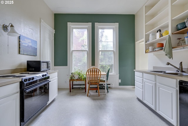 2122 NW Everett St, Portland, OR 97210 - kitchen featuring black appliances, a sink, white cabinets, wainscoting, and open shelves