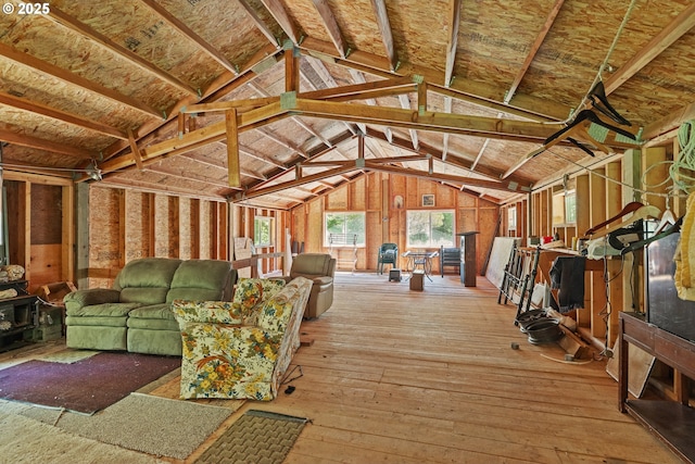 58897 Constance Dr, Bandon, OR 97411 - living room featuring wood-type flooring and vaulted ceiling