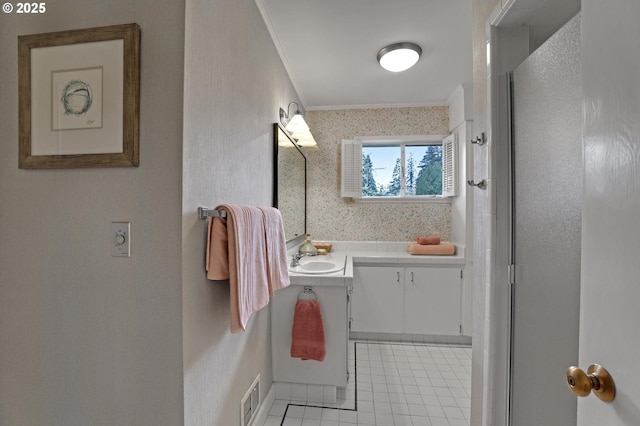 full bathroom with visible vents, crown molding, vanity, tile patterned flooring, and a shower with door