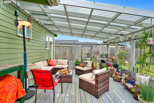 wooden terrace featuring a pergola, an outdoor living space, and a fenced backyard