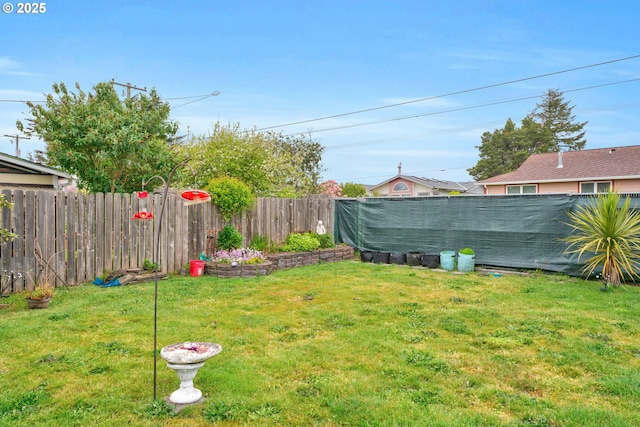 view of yard featuring a fenced backyard