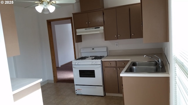 kitchen featuring ceiling fan, sink, and white range with gas stovetop