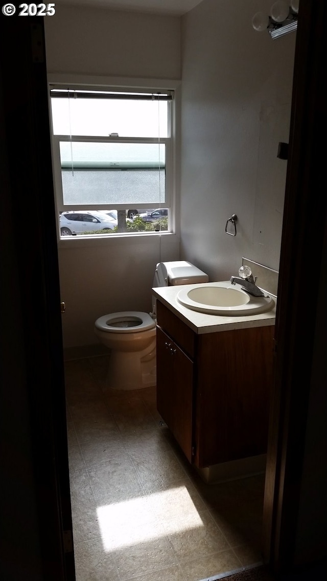 bathroom with vanity and toilet