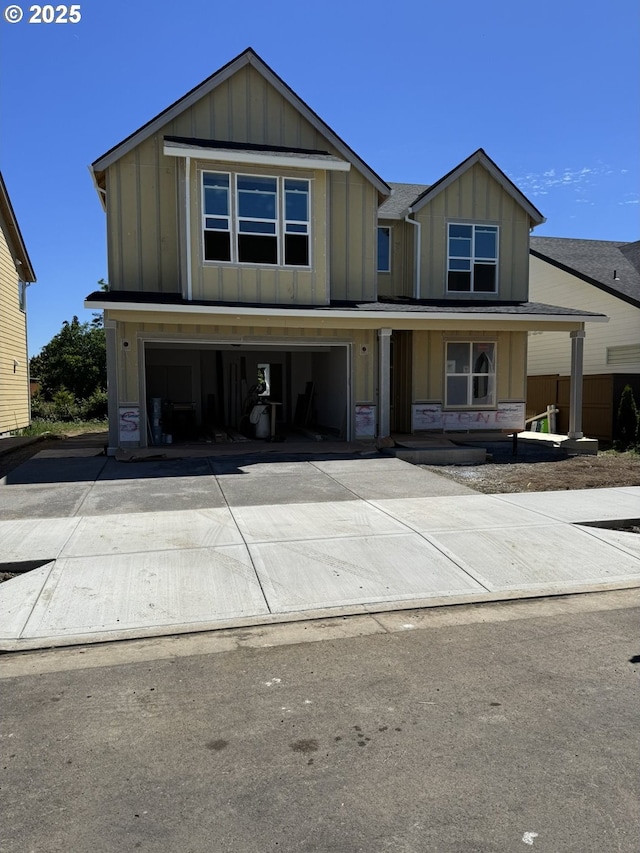 1900 S Holly St, Canby, OR 97013 - view of front facade with board and batten siding, an attached garage, driveway, and a porch