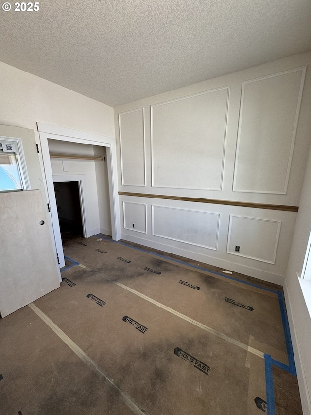 1900 S Holly St, Canby, OR 97013 - unfurnished dining area with a textured ceiling