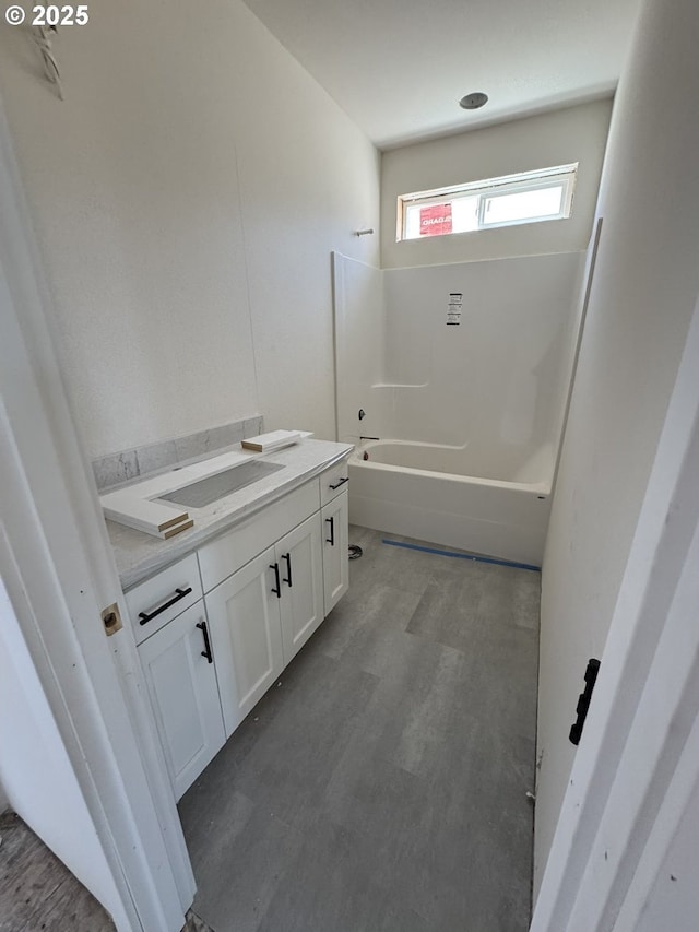 1900 S Holly St, Canby, OR 97013 - full bath with vanity, shower / bath combination, and wood finished floors