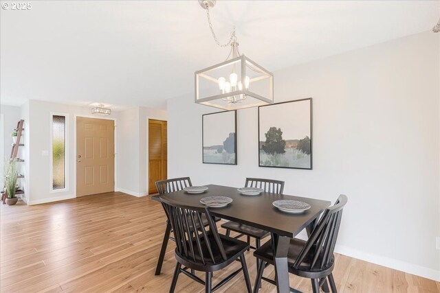 1725 SE Cochran Dr, Gresham, OR 97080 - dining room featuring a chandelier and light wood-style flooring