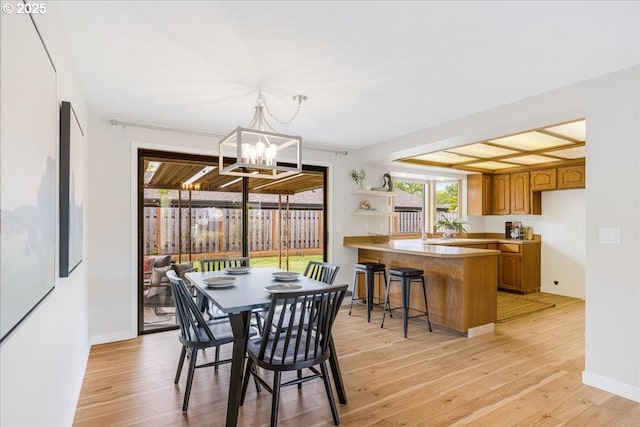 1725 SE Cochran Dr, Gresham, OR 97080 - dining room featuring light wood-style floors and a chandelier
