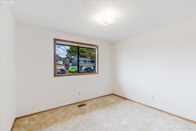 1725 SE Cochran Dr, Gresham, OR 97080 - spare room featuring a textured ceiling and carpet flooring