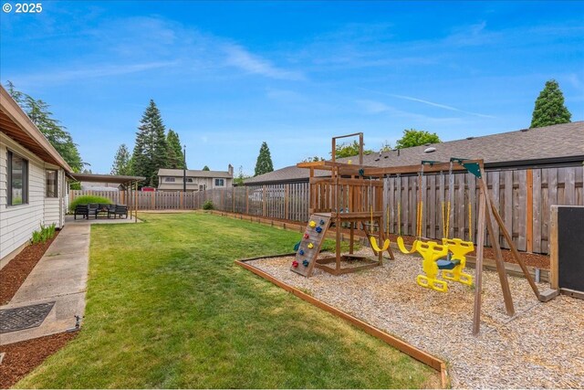 1725 SE Cochran Dr, Gresham, OR 97080 - fenced backyard with a playground and a patio area