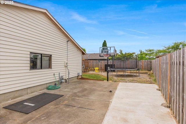 1725 SE Cochran Dr, Gresham, OR 97080 - fenced backyard with a trampoline and a patio