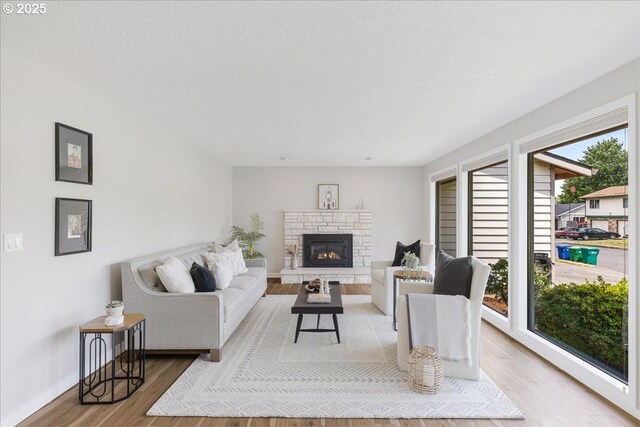 1725 SE Cochran Dr, Gresham, OR 97080 - living area featuring wood finished floors and a fireplace