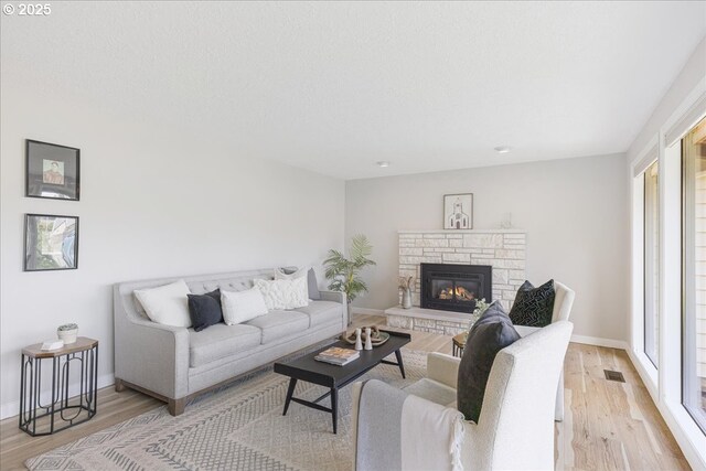 1725 SE Cochran Dr, Gresham, OR 97080 - living room with light wood-style floors and a fireplace