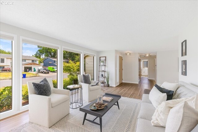 1725 SE Cochran Dr, Gresham, OR 97080 - living room with wood finished floors and a textured ceiling