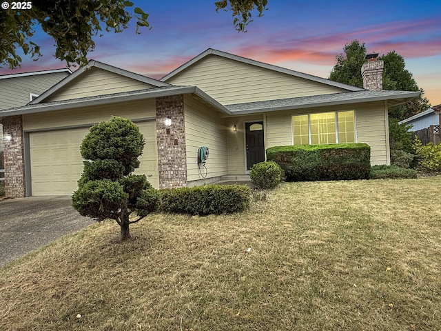 573 SE 73rd Ave, Hillsboro, OR 97123 - single story home featuring a garage, a chimney, a lawn, driveway, and brick siding