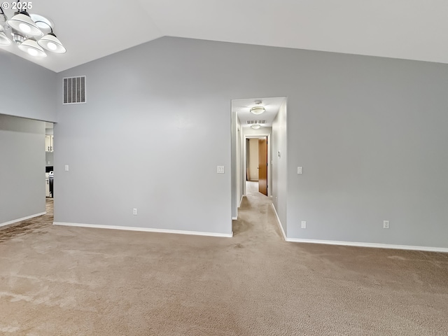 573 SE 73rd Ave, Hillsboro, OR 97123 - empty room featuring light carpet, high vaulted ceiling, and a chandelier